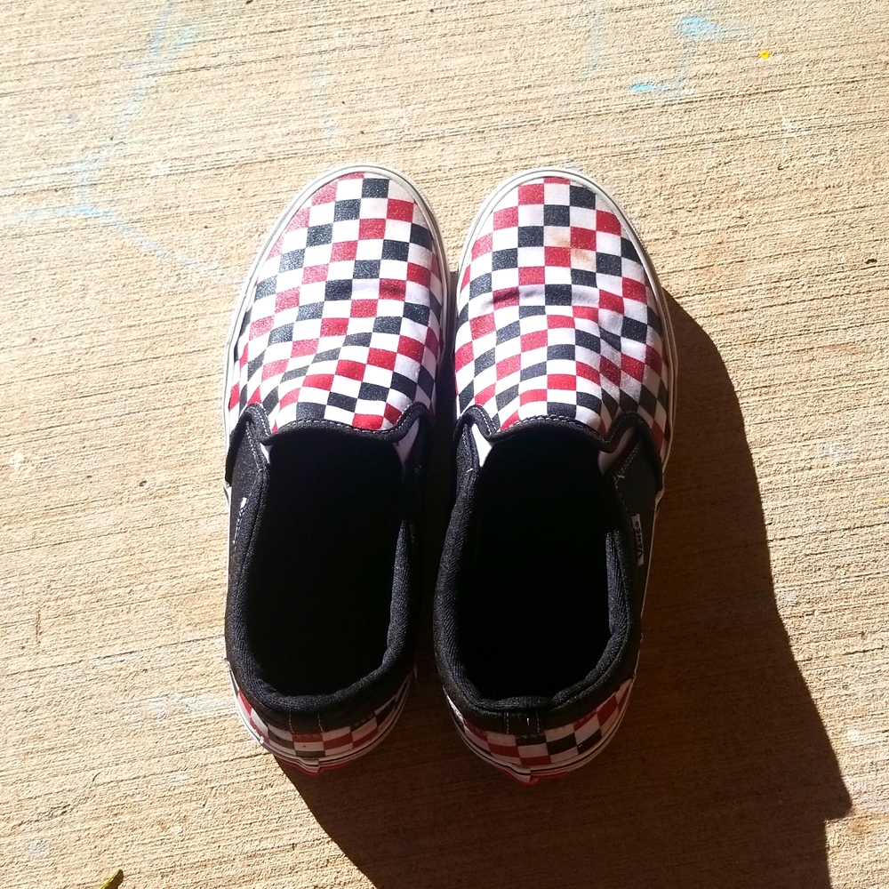 Red,black, and white checkered Vans